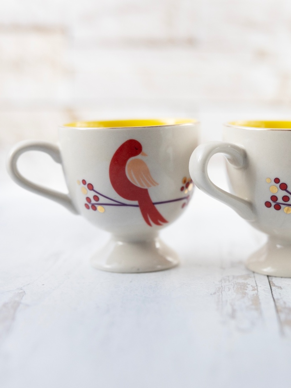 Set of 2 Anthropologie footed mugs bird design red pink gold yellow 3.5" tall